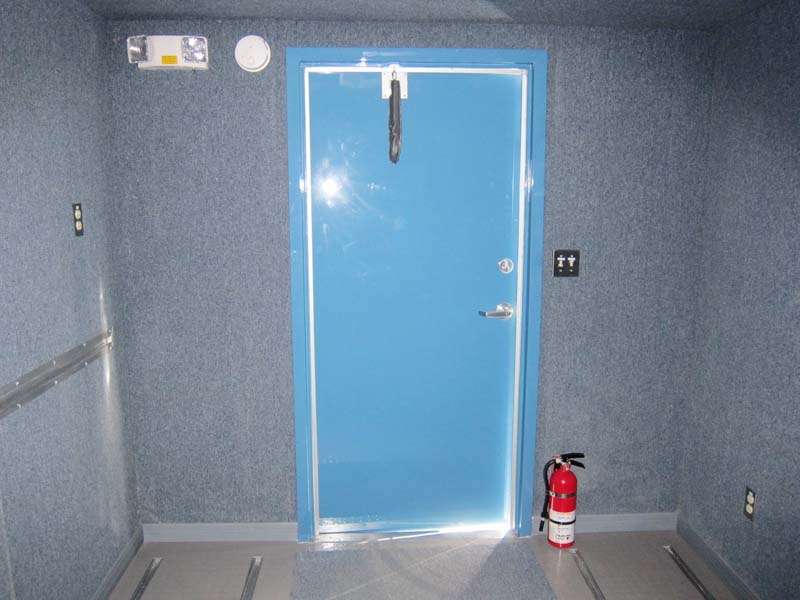 A fire extinguisher near a door