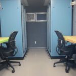Two office chairs with tables