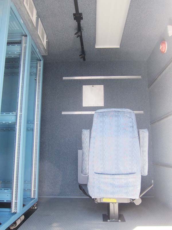 A single chair attached to the mobile shelter’s floor