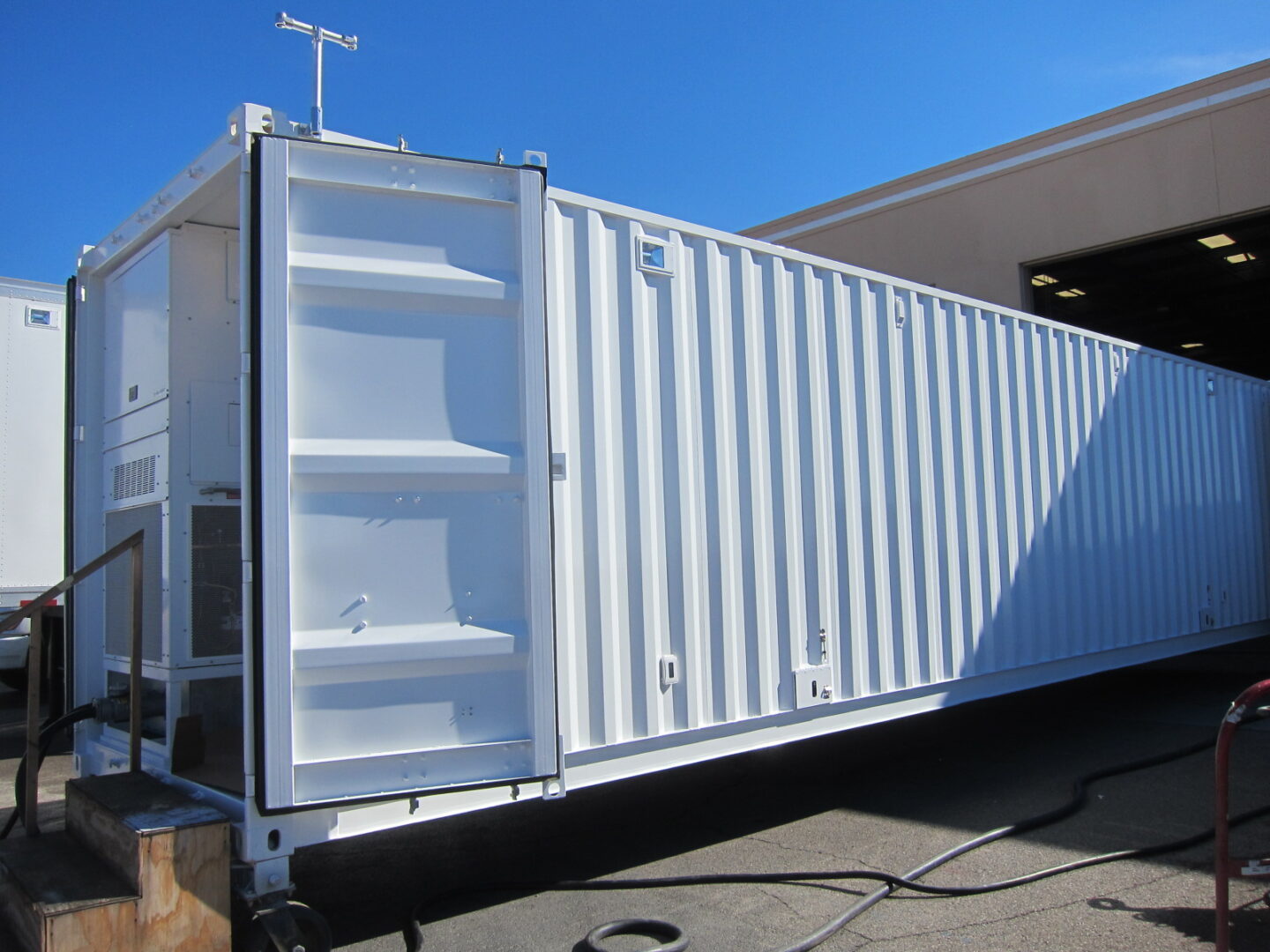 A mobile shelter with an all-white exterior