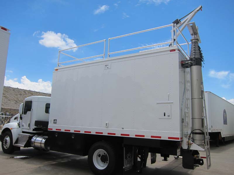 A mobile trailer with an all-white exterior