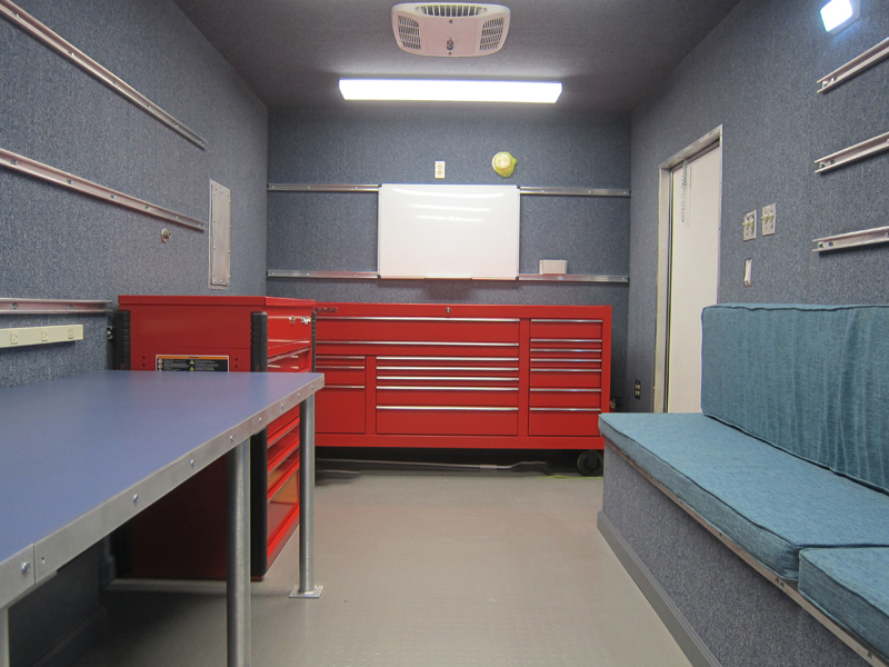 A red cabinet inside the mobile trailer