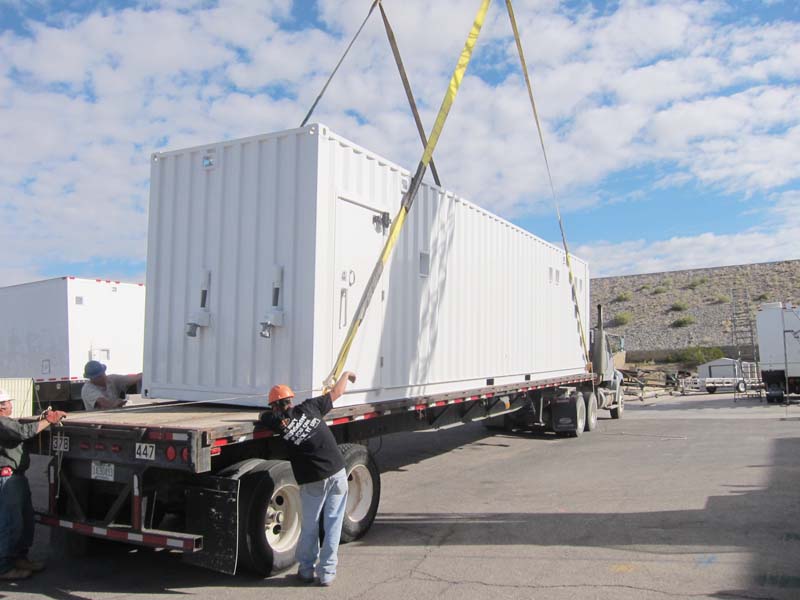 A few men arranging the transportation of a trailer