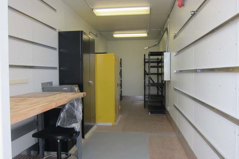 A mini-office with black and yellow cabinets