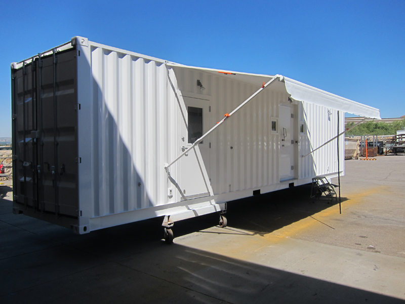 A white movable trailer with a shade