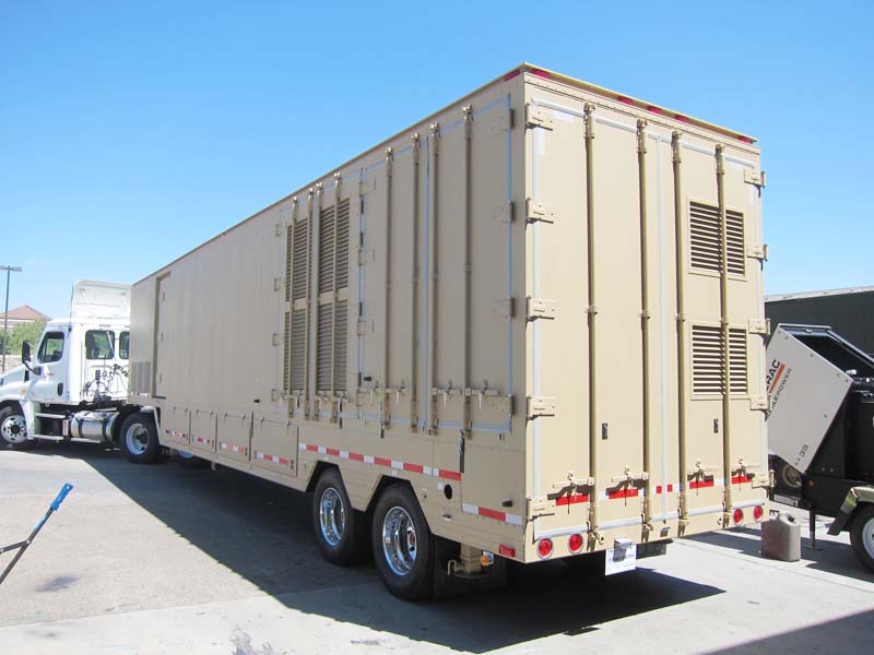 A white and beige 18-wheeler truck